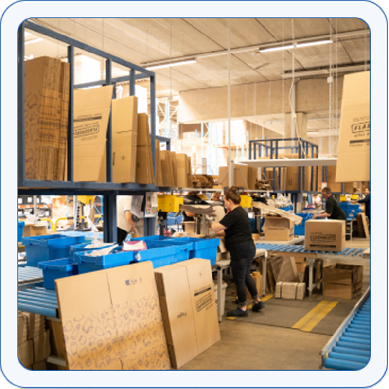 Friendly woman in logistics packs shipments