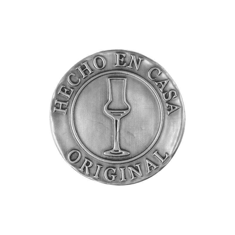 Tin label 'Hecho en Casa', round, metal, silver