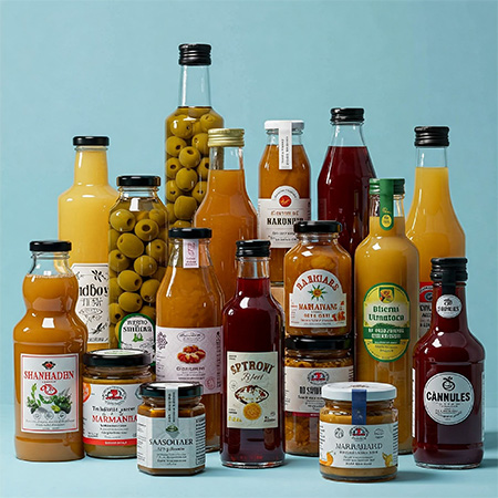Group of filled jars and bottles with food